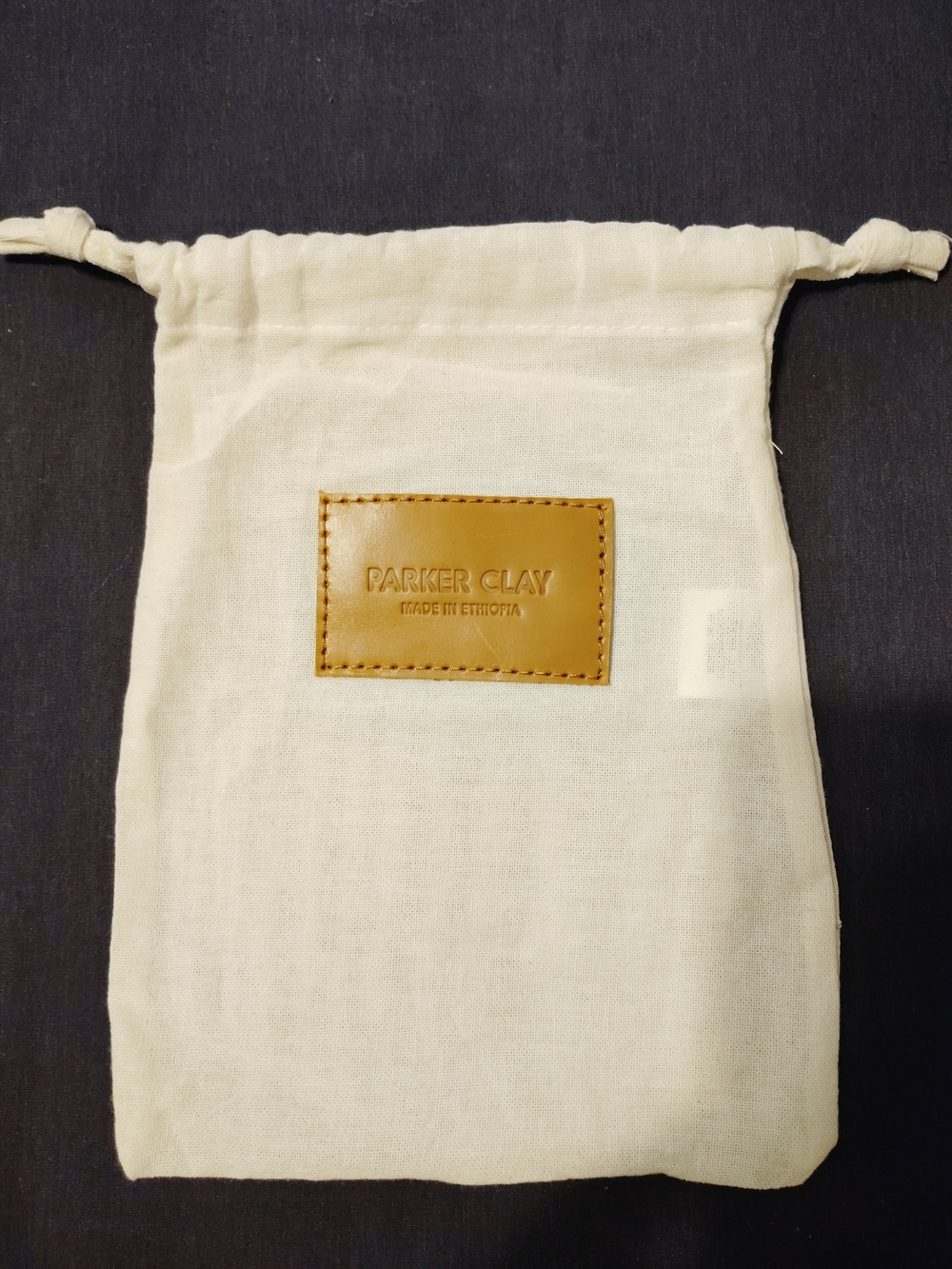 Parker Clay Cream Drawstring Cosmetic Pouch with Tan Leather Patch